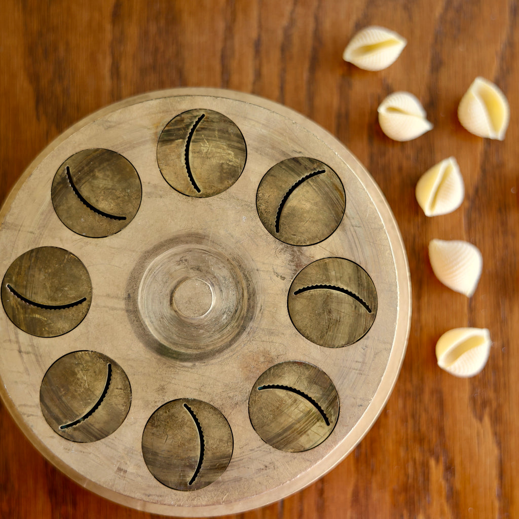 shell die with shells on a wooden surface